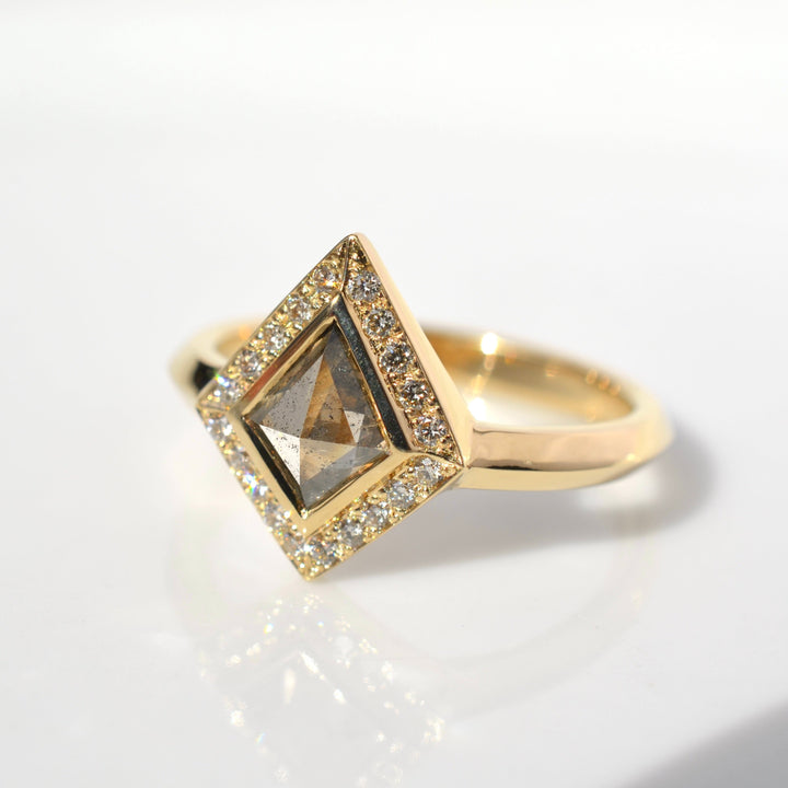 Champagne Kite Diamond set in a yellow gold engagement ring with a halo. Knife edge ring by Emma Brooke Jewelry.