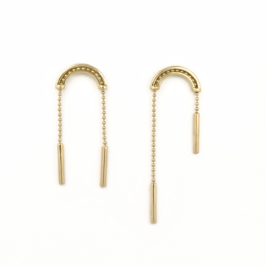Kinetic gold earrings with moving chains on a white background. 