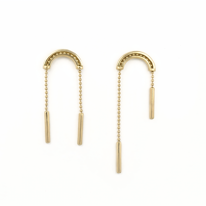 Kinetic gold earrings with moving chains on a white background. 