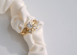 hand carved gold leaf and branch diamond engagement ring set with matching band