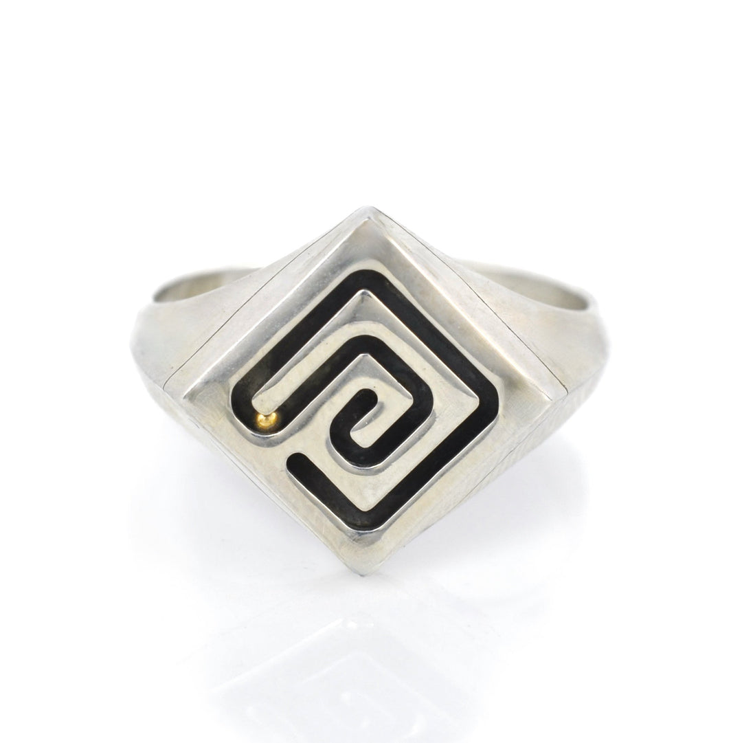 Silver ring with a functioning marble maze and rolling gold ball.