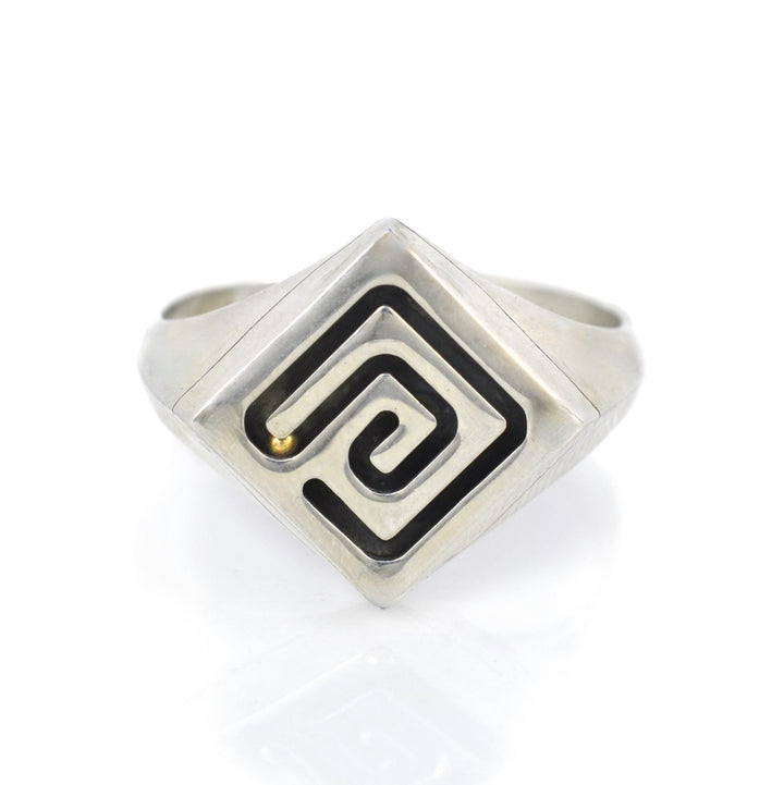 Silver ring with a functioning marble maze and rolling gold ball.